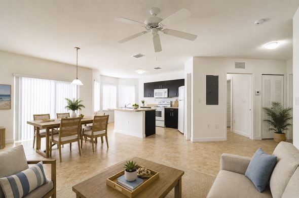 Homestead apartment for rent - A living room with a dining table and chairs.