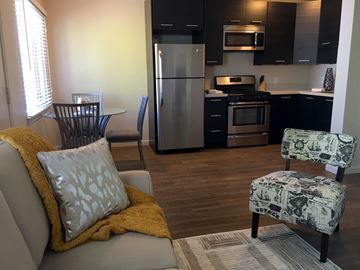 Burlingame apartment for rent - a kitchen and living room with a couch and a chair