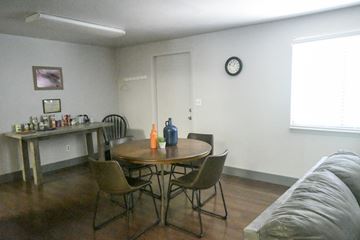 Hurricane apartment for rent - a living room with a table and chairs and a couch