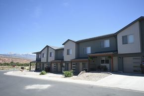 Moab apartment for rent - a row of houses with mountains in the background