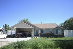 Myton apartment for rent - the front of a house with a car in the driveway