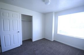 Heber City apartment for rent - an empty bedroom with a closet and a window