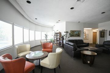 Cedar City apartment for rent - a living room with couches and chairs and a table