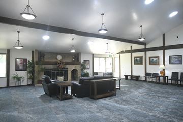 Sandy apartment for rent - a large living room with couches and a fireplace