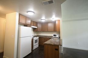 Park City apartment for rent - a kitchen with white appliances and wooden cabinets
