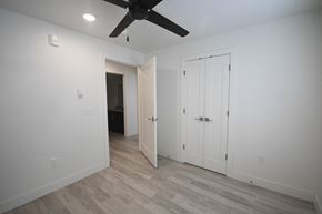 Park City apartment for rent - a bedroom with white walls and a ceiling fan