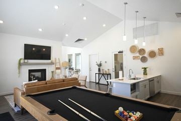Ogden apartment for rent - a living room with a pool table and a kitchen