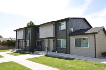 Vernal apartment for rent - A modern two-story house with a grey and white exterior.