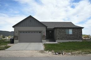 Francis apartment for rent - the front of a house with a driveway and a garage door