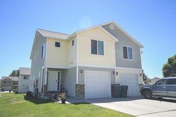 Vernal apartment for rent - a house with a car parked in front of it