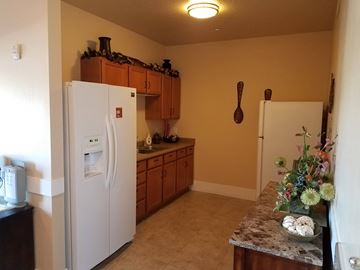 Heber City apartment for rent - a kitchen with a refrigerator and a counter top