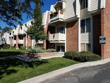 Salt Lake City apartment for rent - an apartment building with a street sign in front of it