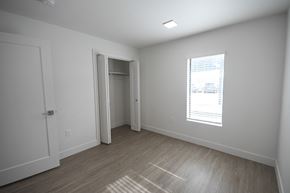 Park City apartment for rent - a bedroom with white walls and a window and a door