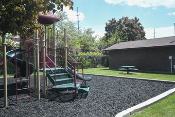 American Fork apartment for rent - a playground with a slide and a picnic table