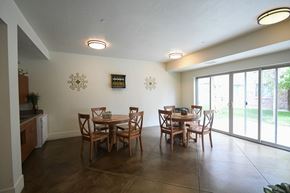 Park City apartment for rent - a dining room with a table and chairs and sliding glass doors