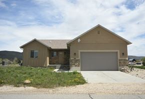 Francis apartment for rent - a house with a driveway and a garage door