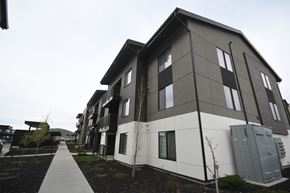 Park City apartment for rent - a row of apartment buildings with a sidewalk in front of them