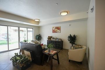 Park City apartment for rent - a living room with a couch and chairs and a table