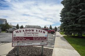 Kamas apartment for rent - a sign for the meadow view apartments parking lot