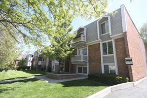 Salt Lake City apartment for rent - the exterior of an apartment building with a lawn and trees