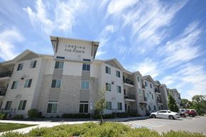 Ogden apartment for rent - an apartment building with a large sign that reads laughing fire points
