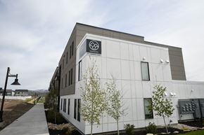 Park City apartment for rent - a large white building with a logo on the side of it
