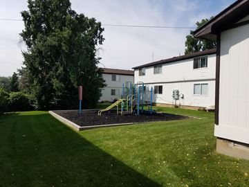 Blanding apartment for rent - a backyard with a playground and a house