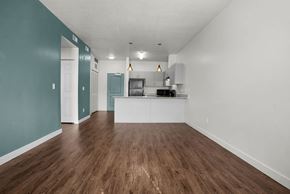 Salt Lake City apartment for rent - A room with a kitchenette and a dining area.