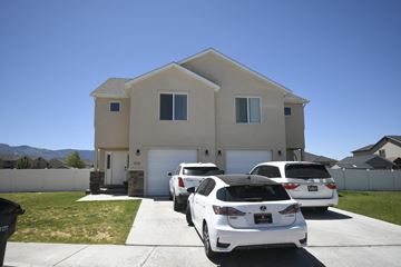 Cedar City apartment for rent - two cars parked in front of a house