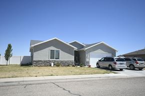 Cedar City apartment for rent - a house with two cars parked in front of it