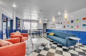 Buffalo apartment for rent - A living room with a black and white checkered floor.