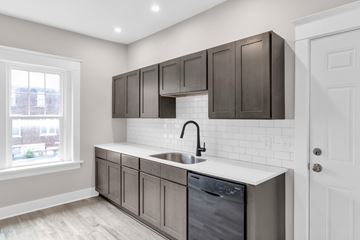 Buffalo apartment for rent - A kitchen with a white counter top and a dishwasher.