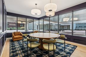 Cincinnati apartment for rent - A modern dining room with a round table and chairs at 7 West 7th Apartments, Ohio, 45202