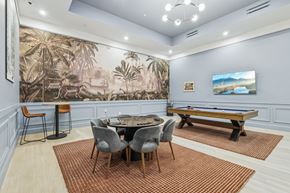 Pittsburgh apartment for rent - A room with a pool table and a jungle mural on the wall. at LiveWell Apartments, Pennsylvania, 15222