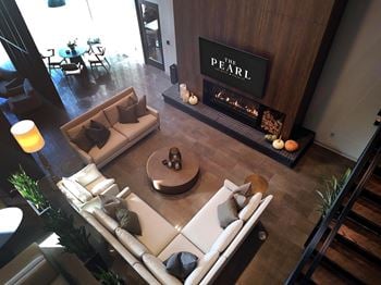 Lobby lounge with a fireplace and a couch.