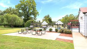 Huntsville apartment for rent - A park with a picnic table and a playground.