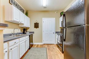 Huntsville apartment for rent - a kitchen with stainless steel appliances and white cabinets