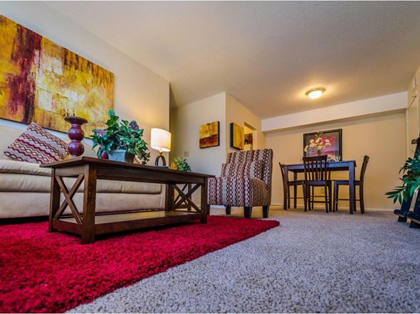 Mobile apartment for rent - a living room with a couch and a table
