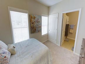Tuscaloosa apartment for rent - a bedroom with a bed and a door to a bathroom