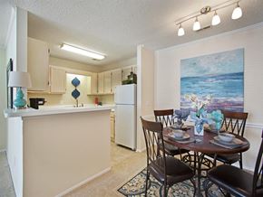 Tuscaloosa apartment for rent - a dining room and kitchen with a table and chairs