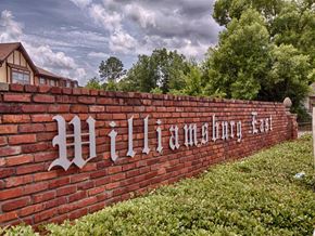Tuscaloosa townhouse for rent - A brick wall with the words "Williamsburg Lane" written on it.