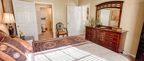 Tuscaloosa apartment for rent - a bedroom with a bed and a dresser