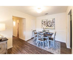 Flowood apartment for rent - a dining room with a table and chairs