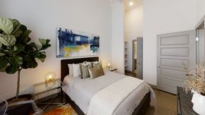 Madison apartment for rent - A bedroom with a large bed and a painting on the wall.