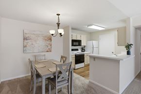 Tuscaloosa apartment for rent - A dining room with a table and chairs is shown.