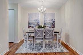 Tuscaloosa apartment for rent - A dining room with a table set for four.