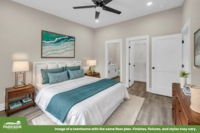 Tuscaloosa townhouse for rent - A bedroom with a bed, nightstands, and a painting on the wall.