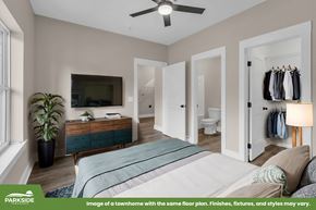 Tuscaloosa townhouse for rent - A bedroom with a bed, dresser, and mirror.