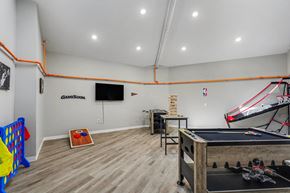 Kansas City apartment for rent - A room with a pool table, a basketball hoop, and a foosball table. at Mayfair Apartments, Kansas City, Missouri