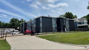 Topeka apartment for rent - an apartment building inside a gated lot